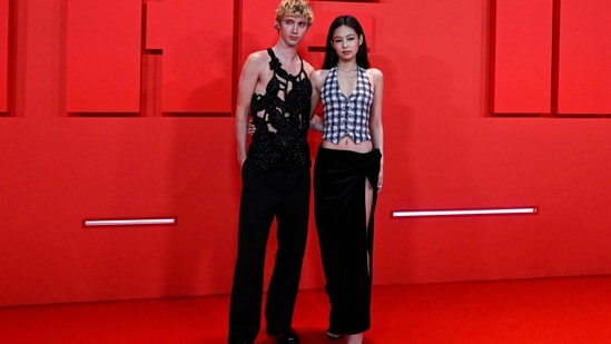Australian actor and singer Troye Sivan poses with K-Pop singer and actor Jennie during the photo call for The Idol. While Jennie wore a monochrome check-printed waist-coat style blouse and a thigh-high slit black skirt, Troye complemented her in a cut-out top and flared black pants. (AFP)
