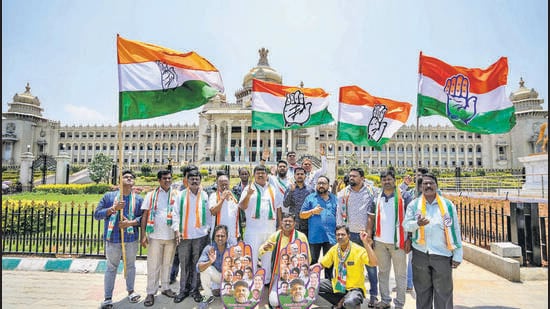 Bengaluru: Congress workers celebrate the party's win in Karnataka Assembly elections, outside Vidhana Soudha in Bengaluru, Sunday, May 14, 2023. (PTI Photo/Shailendra Bhojak)(PTI05_14_2023_000098B) (PTI)