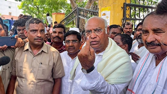 Congress President Mallikarjun Kharge after casting his vote for Karnataka Assembly elections at a polling station in Kalaburagi on Wednesday.(PTI)