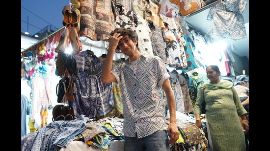 Ayush Juneja, a student of Sri Aurobindo College, finds the perfect party wear at Lajpat Nagar market. (Photo: Gokul VS/HT)