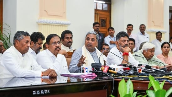 Karnataka chief minister Siddaramaiah with his deputy DK Shivakumar and other cabinet colleagues. (ANI)