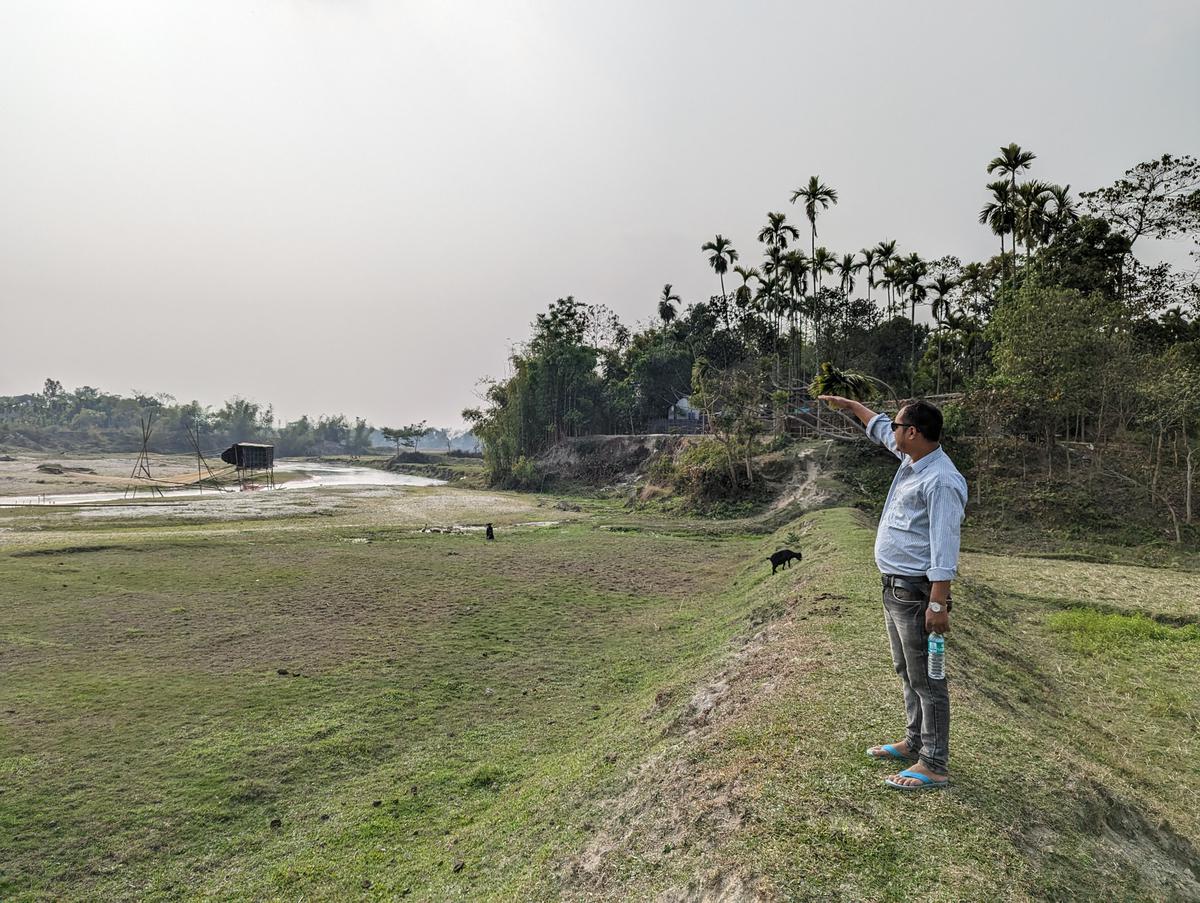 Rahul Marak from Garo Para shows the height of flood Cheko river brings every year.