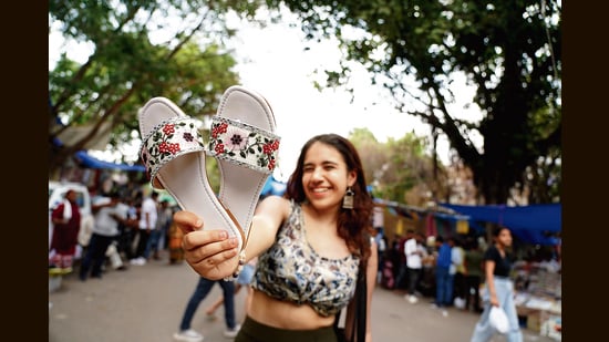 Saakhi Sadh, a student of JMC, opts for white flats from Sarojini Nagar. (Photo: Gokul VS/HT)