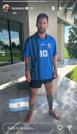 Lionel Messi poses with Diego Maradona's 1994 World Cup jersey.