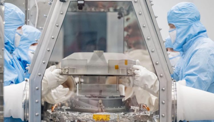 OSIRIS-REx Mission: Initial lid removed, exposes black dust and debris