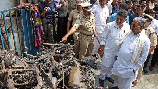 Karnataka chief minister Siddaramaiah and deputy chief minister DK Shivakumar visited the site where a firecracker shop-cum-godown caught fire at Attibele in Bengaluru Rural district. (PTI)