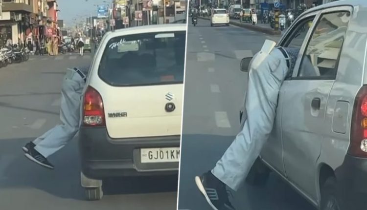 Parking Attendant Manhandled in Ahmedabad: Car Driver Drags Man Into Car, Drives Vehicle for 100 Meters Before Throwing Victim on Road for Demanding Parking Charges; Video Surfaces