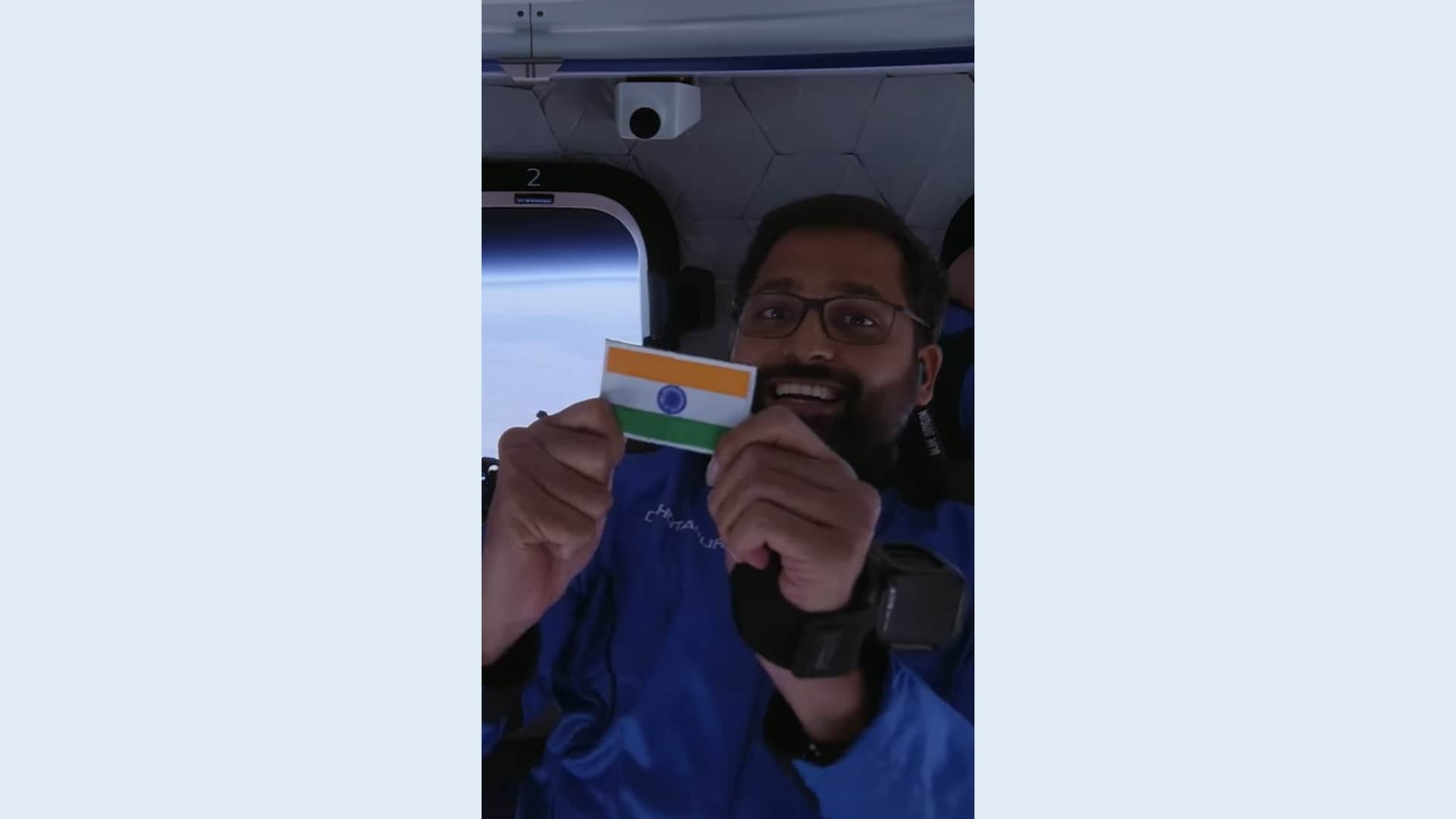 Gopi Thotakura holding Indian flag during Blue Origin NS-25 mission.