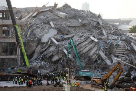 In Bangkok, grim vigils as people seek word of relatives at collapsed building