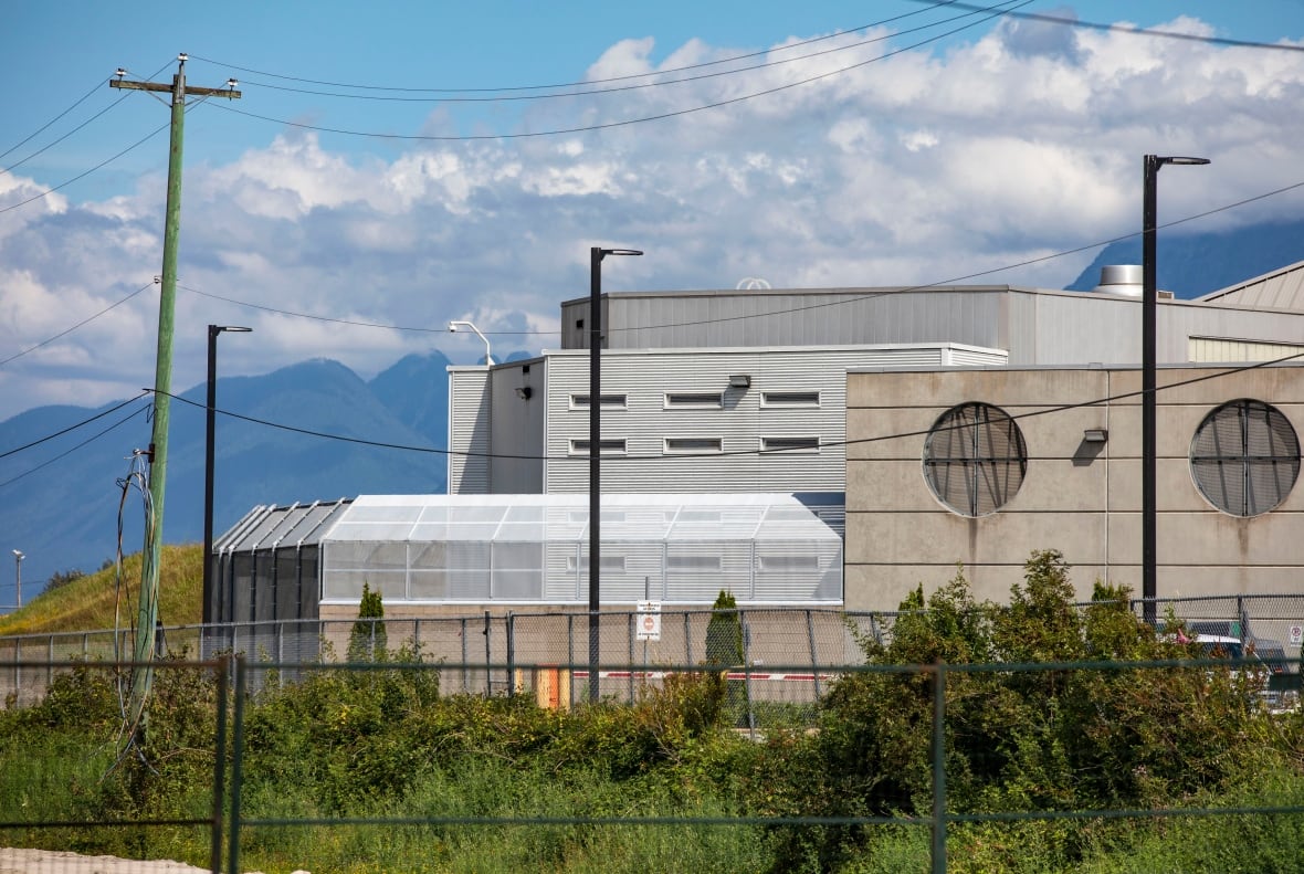 A jail with mountains in the background.