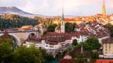 Bern Skyline taken from the Rosengarten at sunrise in Switzerland. 

Church centre: Nydeggkirche
Cathedral right: Berner Münster
Bridge left: Nydeggbrücke