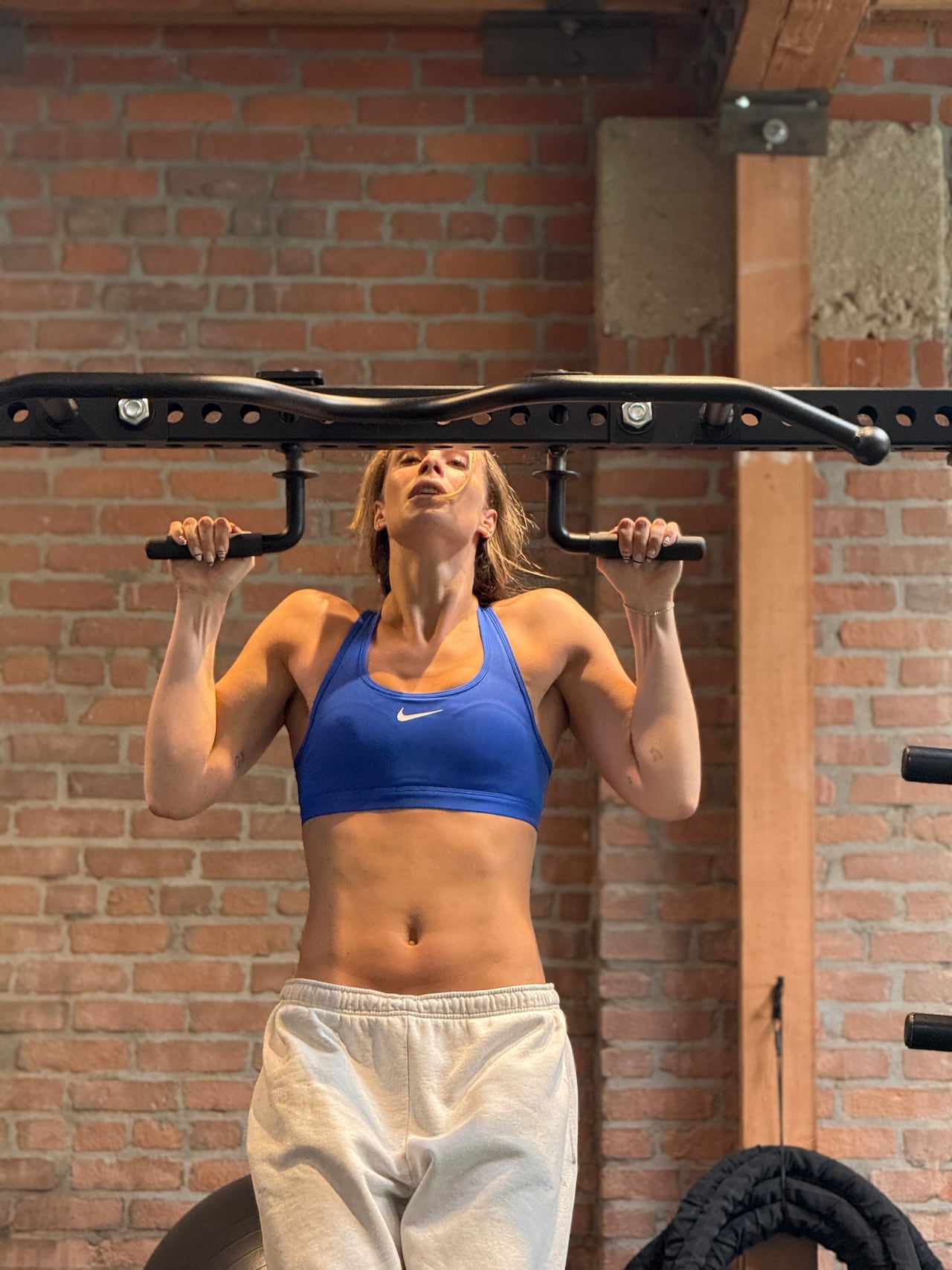A woman works out in a gym.