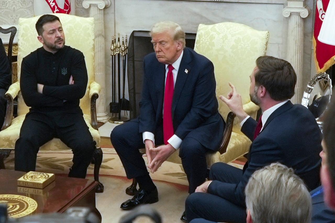 Vice President JD Vance, right, speaks with Ukrainian President Volodymyr Zelenskyy, left, as President Donald Trump listens in the Oval Office at the White House, Feb. 28, 2025, in Washington.
