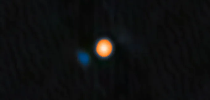 A round blue spot hovers just to the left of a bright yellow bigger circle.