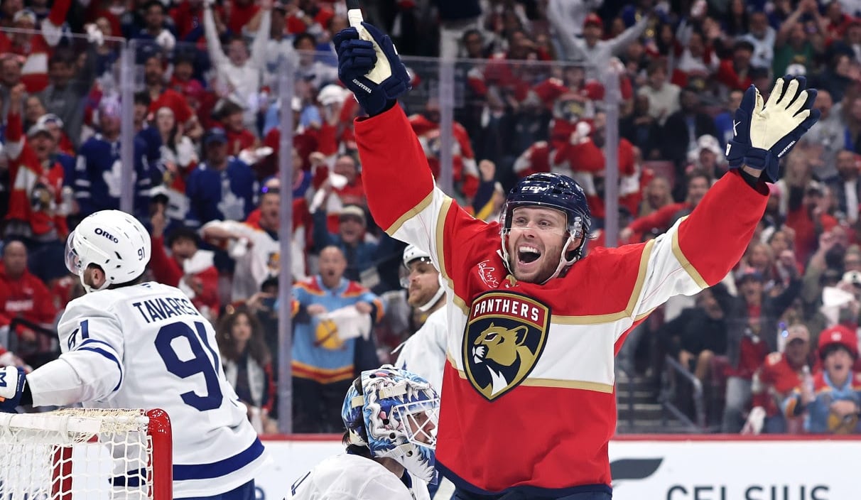 A men's hockey player celebrates.