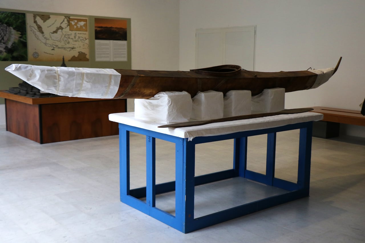 A kayak sits on a stand.